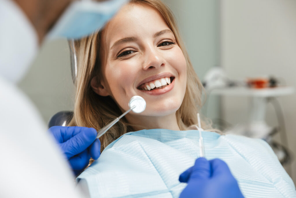 woman smiling at dentistâs office